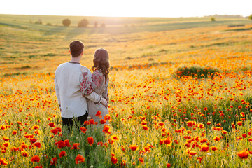 Man and woman standing in field of flowers