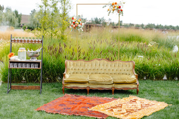 Couch resting on lush green field