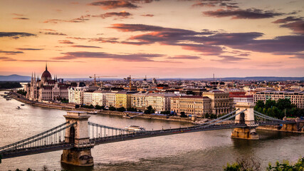 Evening view of the historic Budapest Széchenyi Chain Bridge with the Hungary Parliament building...
