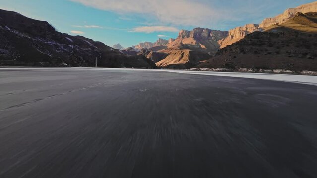 quick FPV drone flight over a frozen lake