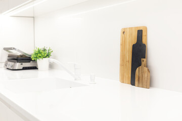 Stylish trendy white kitchen background with utensils