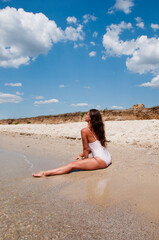 Sexy woman at sea beach. Suntan at summer beach. Beach vacation of sexy girl. Sea travel resort....