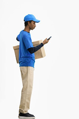 The deliveryman, in full height, on a white background, with a box, talking on the phone