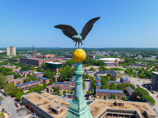 Eagle statue on top of Lowell City Hall in historic city center of Lowell, Massachusetts MA, USA.