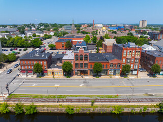 Historic waterfront building on Dutton Street at Upper Pawtucket Canal in Lowell National Historical Park in historic city center of Lowell, Massachusetts MA, USA. 