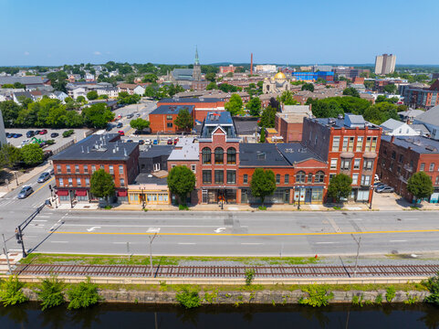 Historic waterfront building on Dutton Street at Upper Pawtucket Canal in Lowell National Historical Park in historic city center of Lowell, Massachusetts MA, USA. 