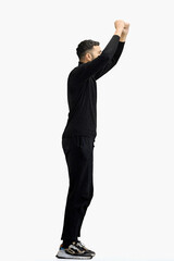 A man, full-length, on a white background, raised his hands up