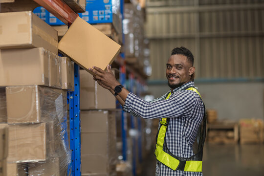 Warehouse worker working in warehouse storage. Foreman or worker work at factory site check up products in site. Inventory worker working in  factory Storehouse
