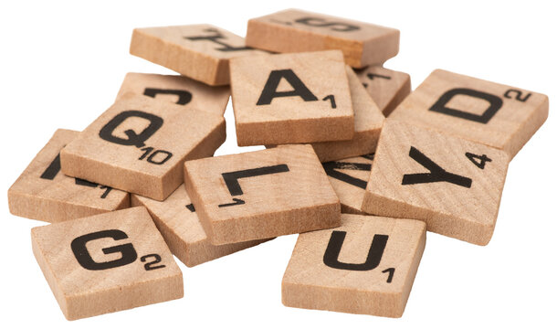 heap of wood blocks tiles scrabble letters isolated on a transparent background