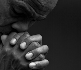 people praying to god with hands together on black background with people stock photo stock image