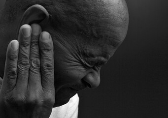 suffering from deafness and hearing loss on grey background with people stock image stock photo	