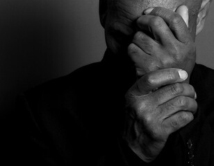 people praying to god with hands together on black background with people stock photo stock image