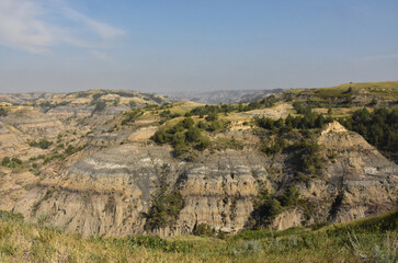 Rugged Rocky Landscape of the Badlands in the Summer - obrazy, fototapety, plakaty