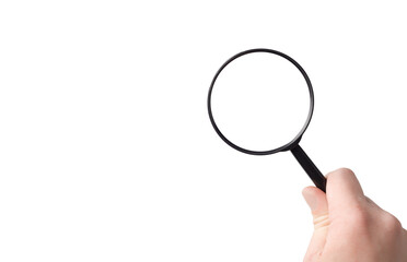 lens, black magnifying glass in hand in hand on a isolated background close-up