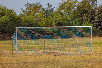 Soccer Goal Net Empty Sport Field in Village Yellow Grass Autumn Day