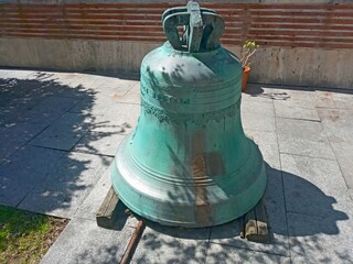 Old bell covered with green patina