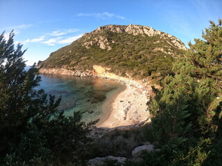 Sandy beach on Pirates Bay, Porto Timoni, Afionas village location. Amazing morning seascape of...