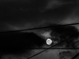 Lunar Majesty. The Drama of the Full Moon in a Darkened Sky. Black and white. Monochrome.