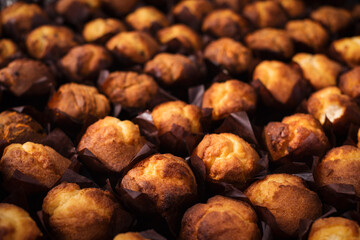 Close up. Muffins pattern, on the showcase, background.