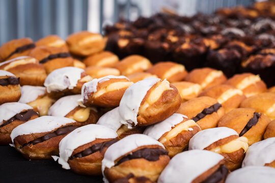 Close up. Maritozzi, sweet buns with cream on showcase.