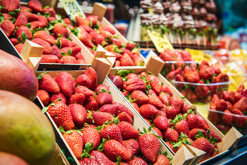 Close up. Fresh strawberries on showcase, Spanish food market.