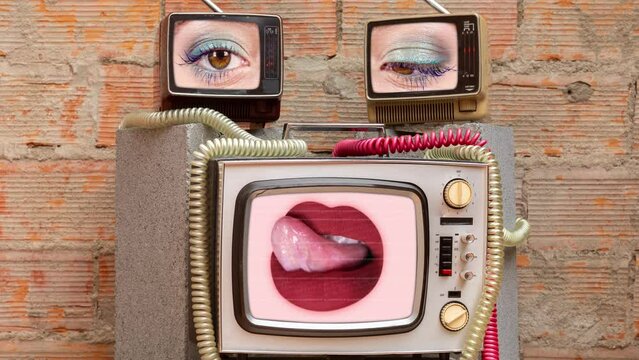 retro televisions with lips and eyes on the screens