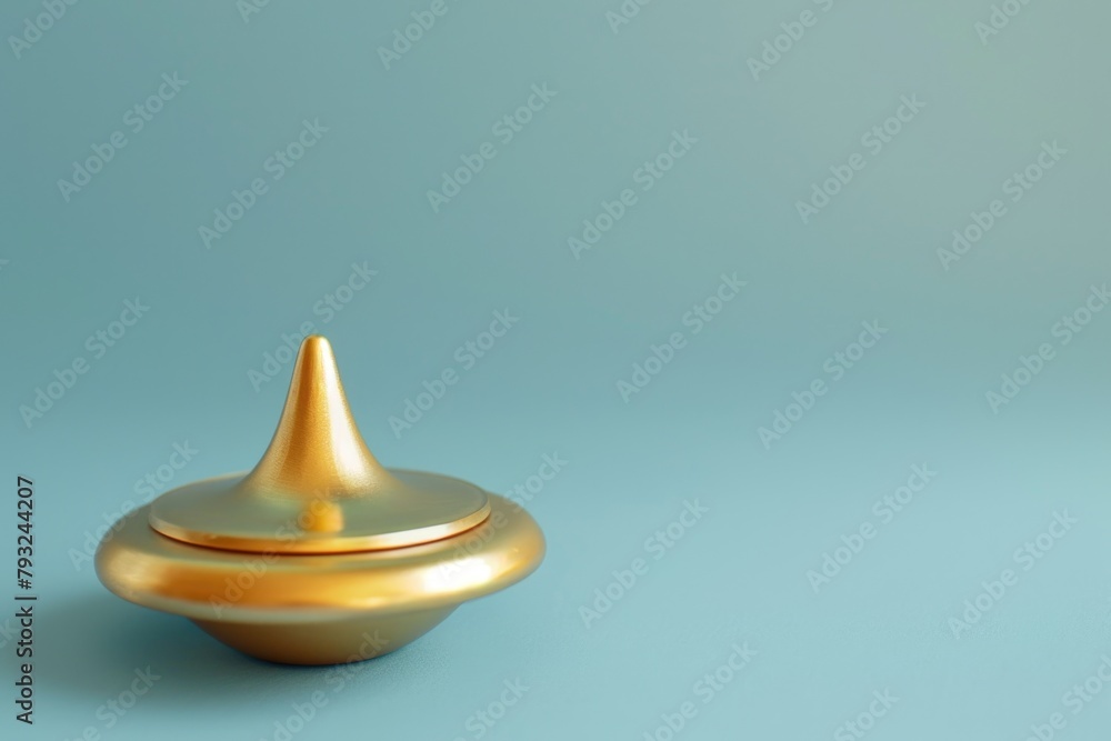 Poster a shiny golden object resting on a vibrant blue background. suitable for various design projects