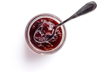 A jar of jam with a spoon, perfect for food blogs or recipe websites
