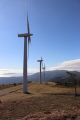 Image of three windmills on top of Monte Pindo, in Carnota (Galicia, España), with the mountains...