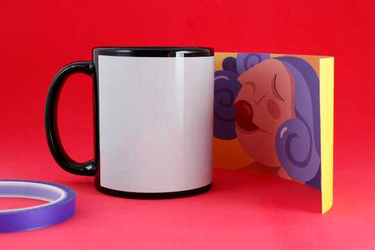 Black mug with paper and thermal tape to sublimate
