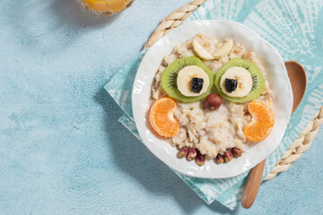 Kids breakfast porridge with fruits and nuts