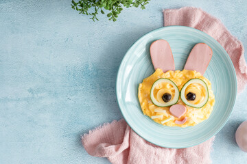 Easter breakfast scrambled eggs with cute bunny face