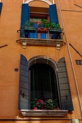 an old window with shutters of a house in Venice.
