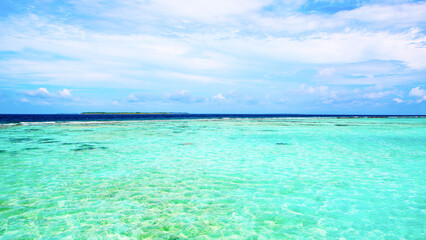Beautiful landscape of clear turquoise Indian ocean, Maldives islands