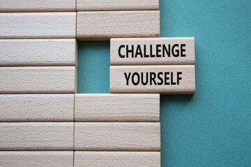 Challenge yourself symbol. Wooden blocks with words Challenge yourself. Beautiful grey green background. Business and Challenge yourself concept. Copy space. - obrazy, fototapety, plakaty