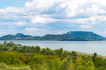 Fototapeta na wymiar Summer Balaton landscape with volcanic mountains and clouds in the background