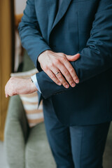 Guy is getting dressed for a business meeting.