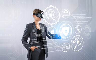 Business woman pointing and accessing at security protection system while using visual reality goggles. Professional project manager looking privacy firewall code by using VR headsets. Contraption.
