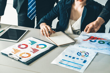 Businessman and businesswoman in meeting working with many financial statement document on desk....