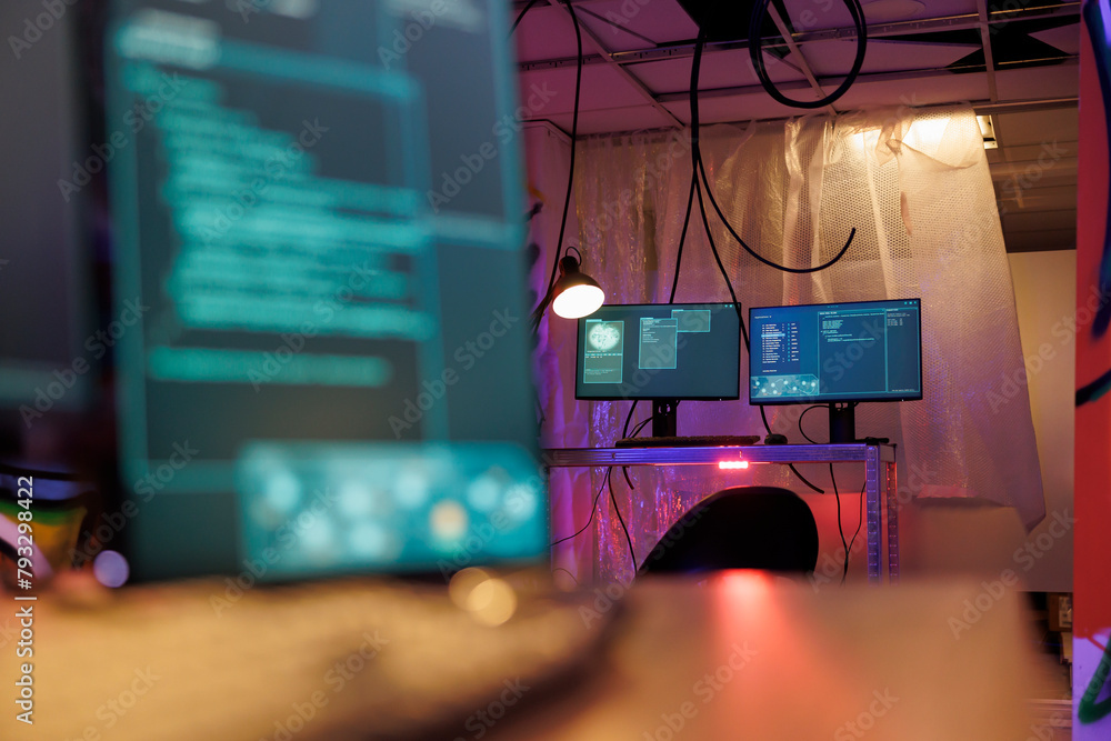 Poster computer screens with malware running code stealing sensitive information in hackers abandoned wareh