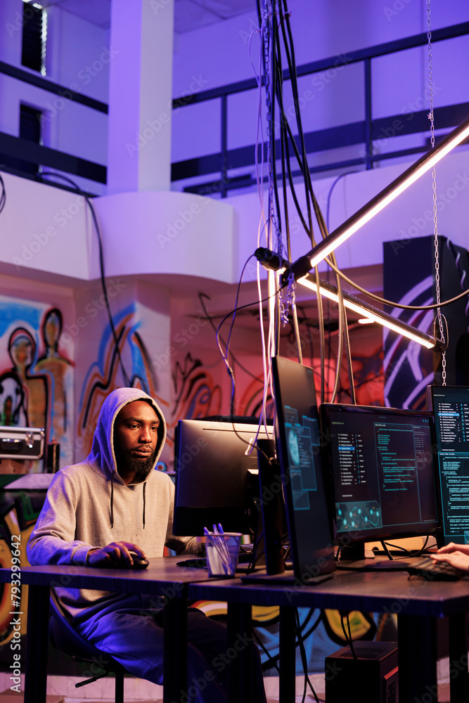 Poster african american criminal hacking into server and cracking password on computer. hacker breaching cy