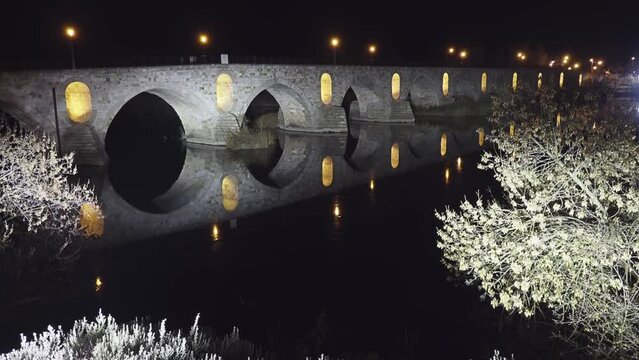 Illumination on Stone bridge on Duero river. Zamora is a city in Castile and Leon, Spain. Evening time.