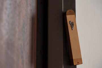 Jewish mezuzah on the doorpost, a prayer for home protection in Judaism. Modern mezuzah in Israel.
