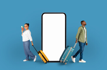 Travelers walking by phone mockup on blue backdrop