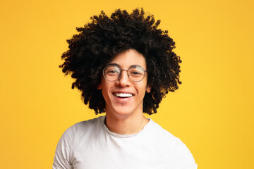 Fototapeta na wymiar Carefree smiling african-american man with bushy hairstyle