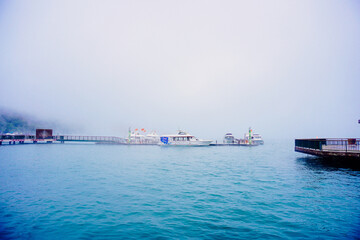 Sun Moon Lake，Nantou, Taiwan, Republic of China, 01 22 2024: The landscape of Sun Moon Lake in a cloudy and foggy day