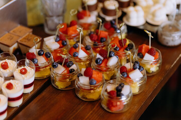 assorted fresh fruits, berries and citrus fruits. Fruits for holidays. candy bar on holiday