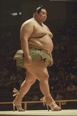 Sumo Wrestlers Graceful Strut in High Heels During an Unconventional Fashion Show