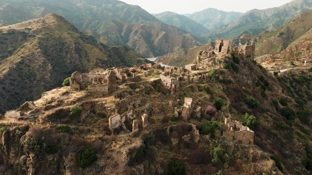 Ancient ruins of a medieval castle on top of the mountain. Amendolea Castle. 