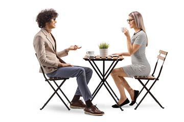 Young man and woman having coffee and talking